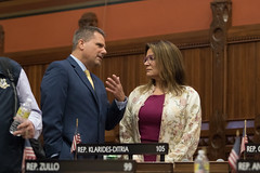 State Rep. Chris Aniskovich talks with Rep. Nicole Klarides-Ditria during a session day in the House of Representatives.