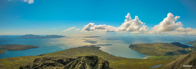 Incredible summit view from Sgurr Alasdair, highest point on the 6,000 offshore islands of Britain. Left to right, Isles of Eigg, Soay, Rum, Sanday, Canna and Outer Hebrides. Glenbrittle and beach, bottom right. Isle of Skye, Scotland.