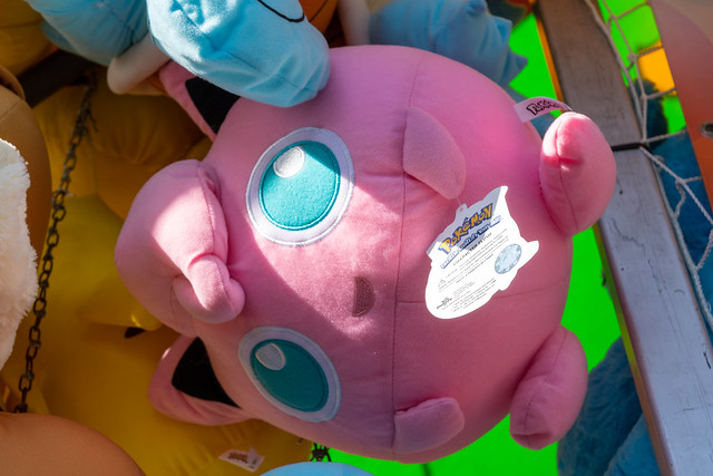 Calgary, Alberta, Canada - July 16, 2022: A Jigglypuff pokemon stuffed plush toy offered as a prize for winning a carnival game