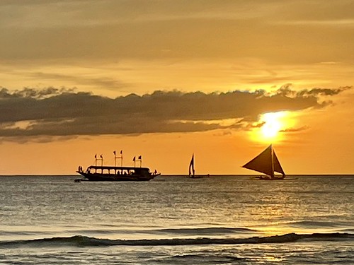 sunset boracay paraw boats philippines tropics sea