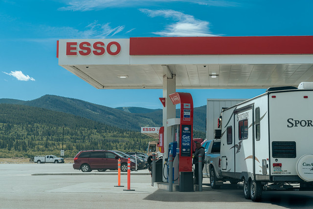 Morley, Alberta, Canada - July 8, 2022: Esso gas station, as an RV fills up with fuel in summer, near the Canadian Rockies