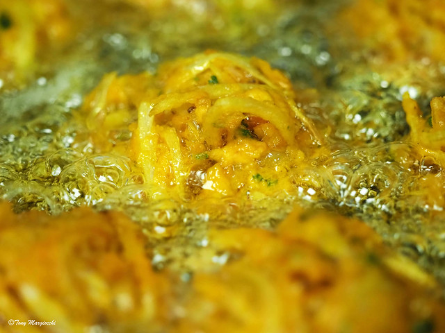Onion Bhajis cooking.