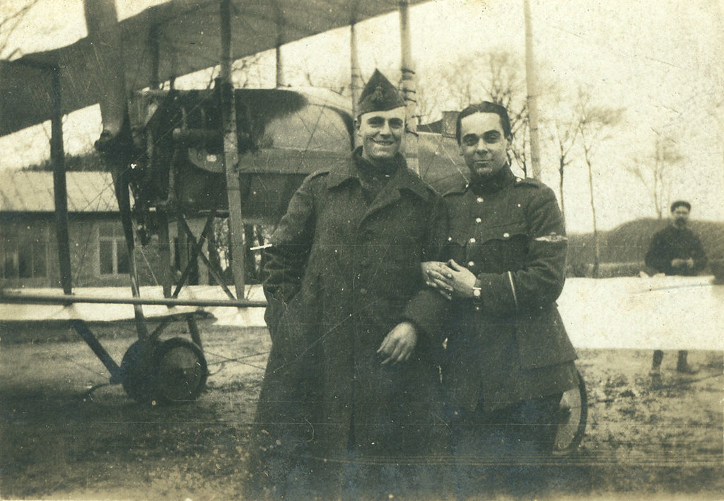 Two Belgian servicemen in front of an airplane (1917)