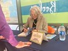 Sandy signing books