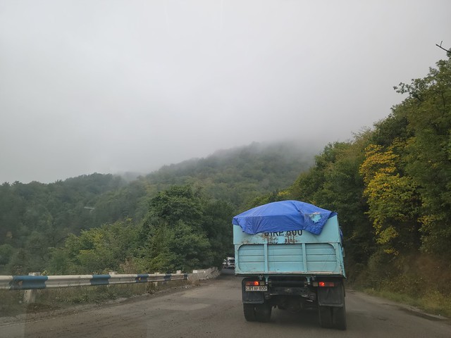 The road through the mountain pass was shrouded in clouds.