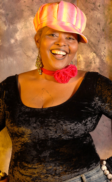 DSC_0207v Ammy Togolese Singer in Black Top and Pink and Yellow Hat with Red Rose Neckband Portrait Photoshoot Shoreditch Studio London