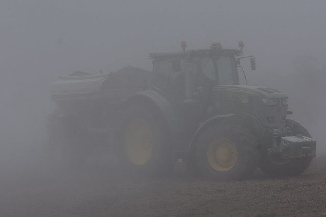 John Deere 6195R Tractor with a Bredal K85 Bulk Spreader