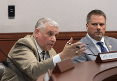 Rep. Bill Pizzuto raises questions during a Public Hearing