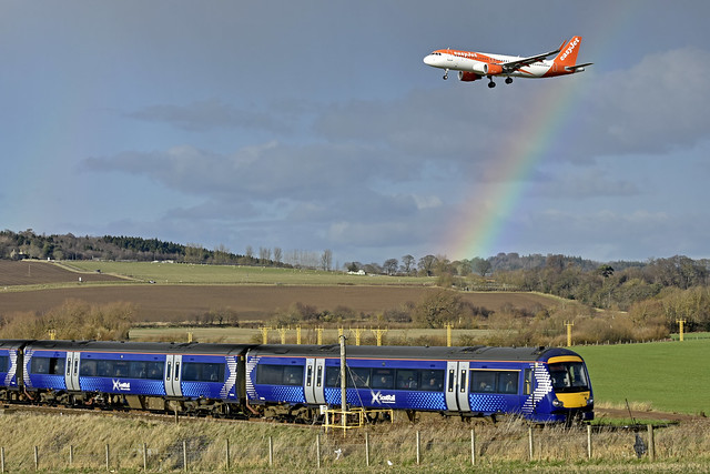 Rainbow looks on as Easyjet A320 lands and Scotrail Class 170 DMU heads for Edinburgh,22-02-23