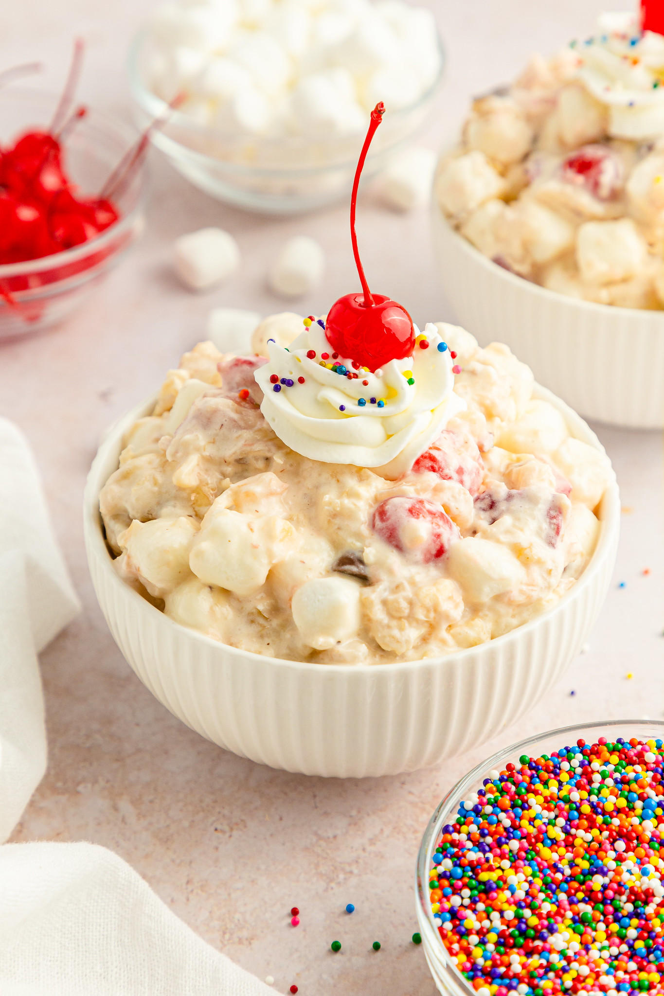 Banana Split Fluff is a delicious and indulgent dessert that combines the classic flavors of banana split with the light and fluffy texture of marshmallows. It's the perfect no bake treat for summer! 