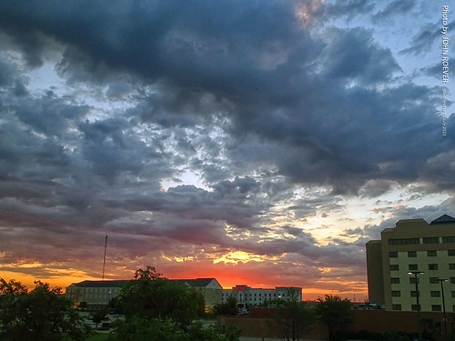Before sunrise in Cedar Rapids, 13 July 2022 by photography.by.ROEVER, A view at clouds and slight sunlight before sunrise, as seen from the Holiday Inn Express along Coll
