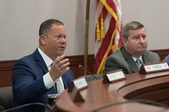 State Rep. Craig Fishbein, Ranking Member of the Judiciary Committee, asks questions to a representative from the Secretary of State's Office during a public hearing in the Committee.