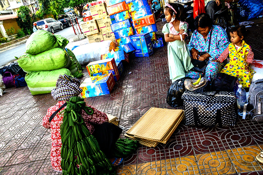 Woman selling hammocks and woven mats outside GTF Express on 2-28-23--Phnom Penh copy