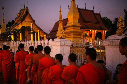 Alms giving ceremony - Luang Prabang, Laos by Maciej Dakowicz, The Tak Bat Morning Alms Giving Ceremony at sunrise in the city centre of Luang Prabang, Laos. Feb 2