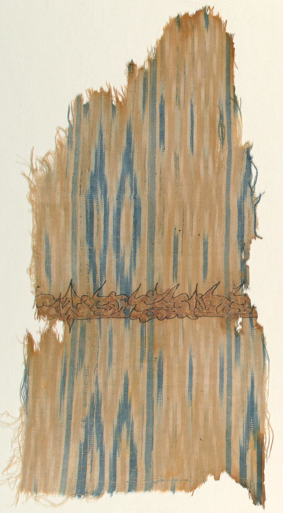 A frayed weaving of blue, tan, and ivory-colored threads, crossed by a horizontal band of pseudo-Arabic script painted in gold leaf.