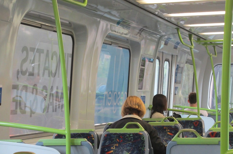 Advertising over the windows on a Comeng train (February 2013)