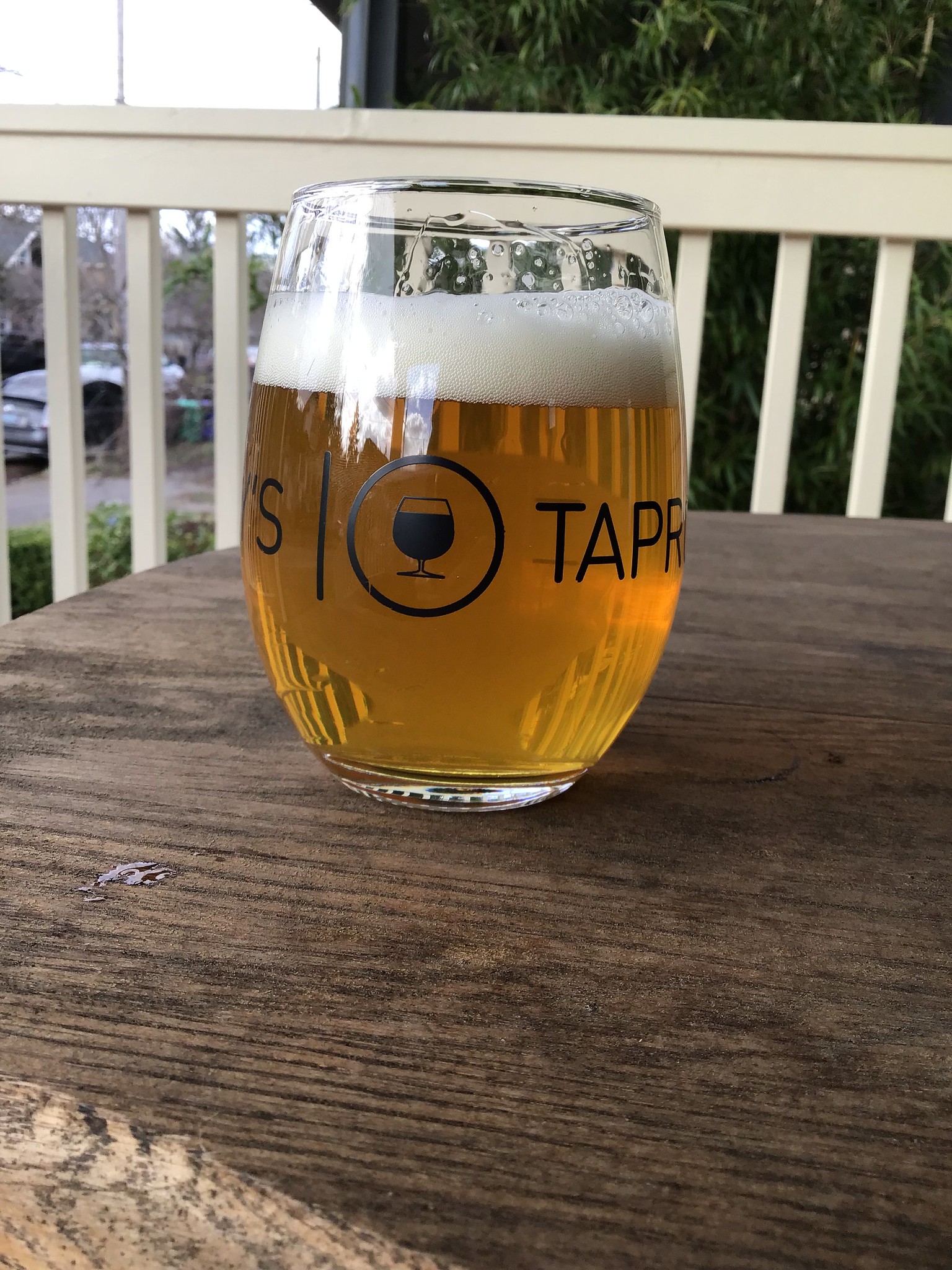Bend brewing's Hop Head DIPA in glass on table outside