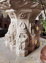 Seven Sacrament font: beheaded seated cleric