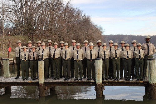 Photo of group of uniformed rangers on a pier