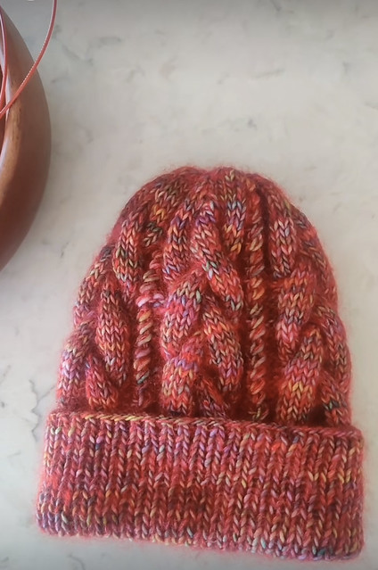 Veronica (@xov.knits) decided to splurge and knit an October Braid Beanie for herself. Yarn is Malabrigo Washted in Arco Iris held double with Drops Kid Silk in Red.