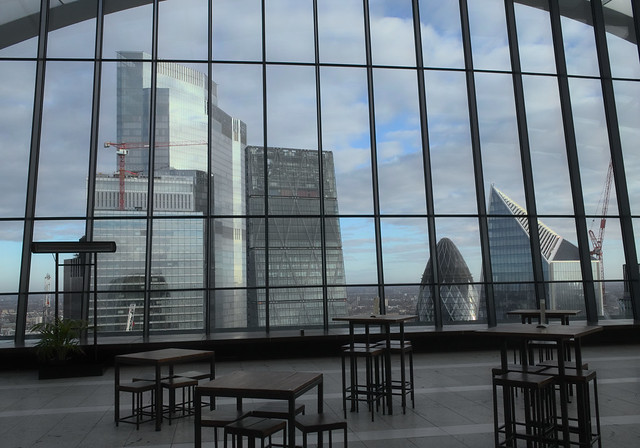 Objects: a walkie-talkie, a scalpel, a gherkin, and a cheesegrater