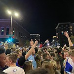 Celebrating KU 2022 National Championship Celebrating KU winning the &lt;a href=&quot;https://en.wikipedia.org/wiki/2022_NCAA_Division_I_men&#039;s_basketball_championship_game&quot; rel=&quot;noreferrer nofollow&quot;&gt;2022 national basketball championship&lt;/a&gt; in downtown Lawrence, KS.

I have no idea why there&#039;s a guy in a shopping cart messing around on his phone while being hoisted above the crowd.