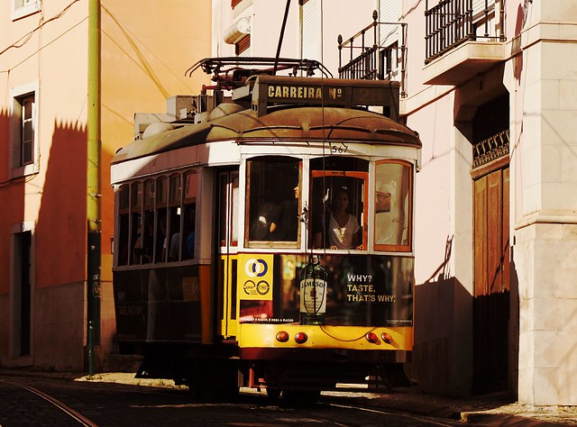 To stand at the back of Carreira No 28 and watch life in Lisbon slip by