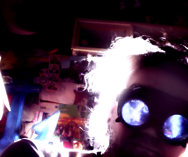 Steam punk me with goggles in a dark room (my room a few years ago) almost sci-fi in character Futuristic selfie  photography pic