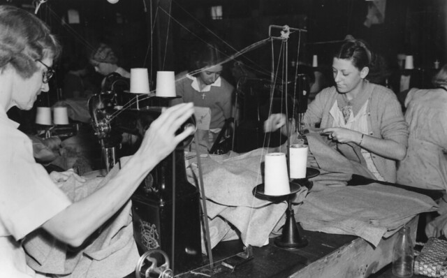 Clothing industry workers sewing military uniforms 1940