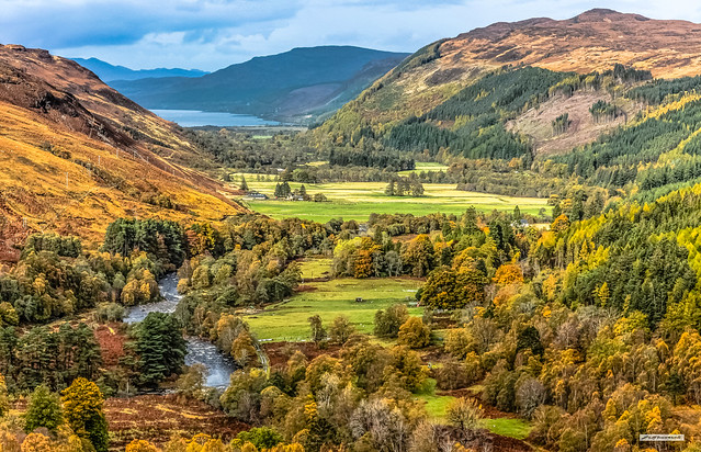 Loch Broom and the vibrant Autumn colours of the valley of the River Broom, Wester Ross, Scotland.