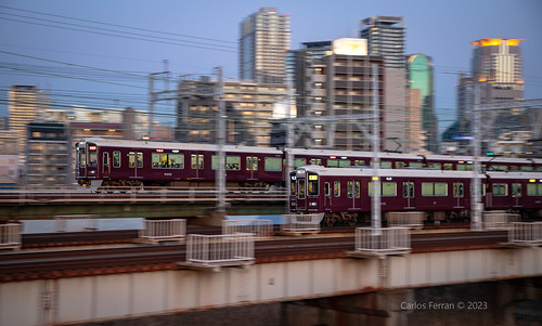 hankyu electric railway train trains urban city japan osaka sunset blue hour 9000 series commuter suburban skyline bridge kansai pan pace