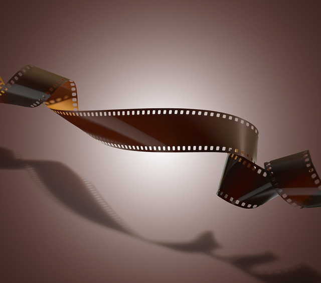 Floating twisted film for photo or video recording on brown gradient