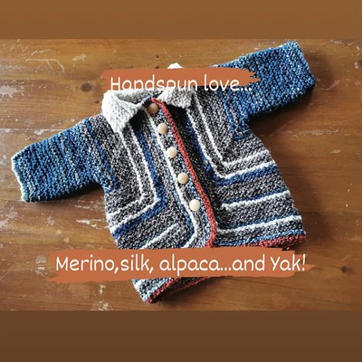 Paulette finished this Baby Surprise Jacket by Elizabeth Zimmermann using her hand spun yarn.