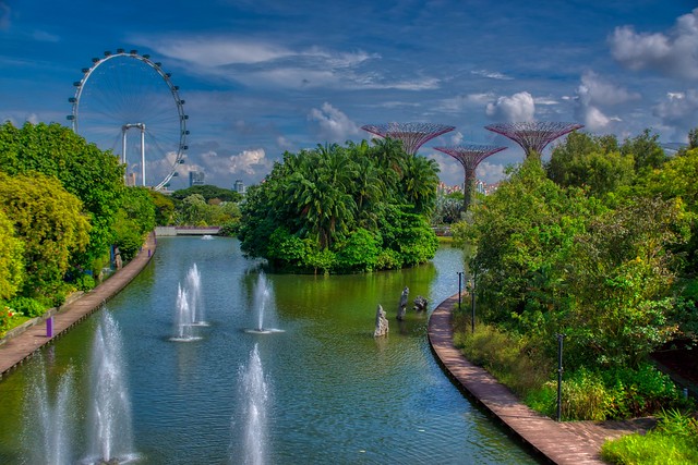 Gardens by the Bay with lake, fountains and super trees in Singapore