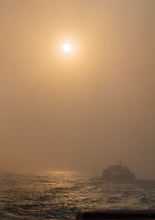 Venice boat ride in the fog during sunset