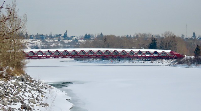 The Peace Bridge, Calgary, arching over a frozen Bow River