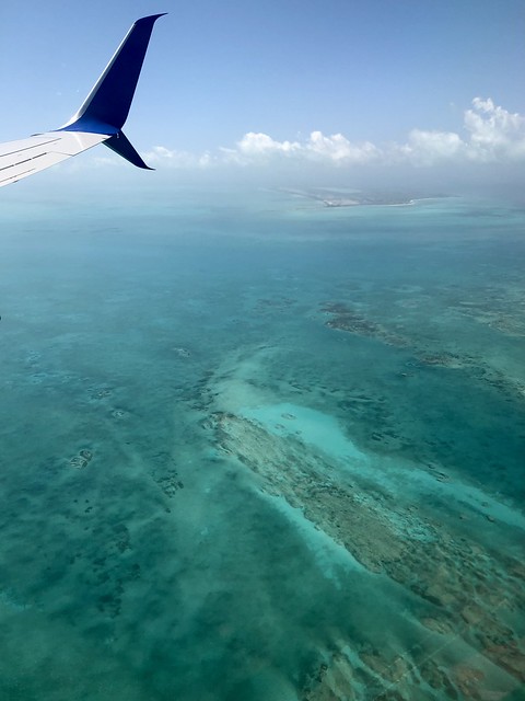 Brilliant turquoise waters, landing at Providenciales, Turks and Caicos