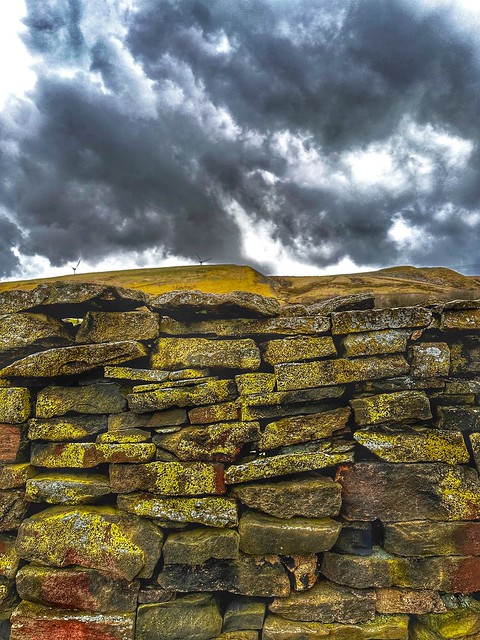Dry stone wall, hilltop, and sky