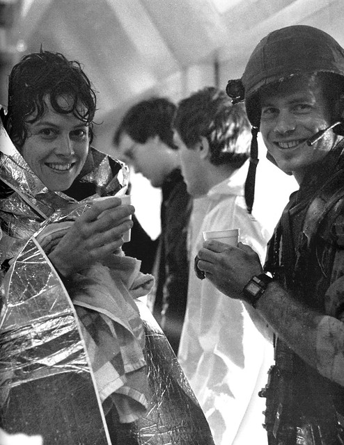 Sigourney Weaver and Bill Paxton keeping warm while filming scenes in the medical center facehugger attack in Aliens (1986)