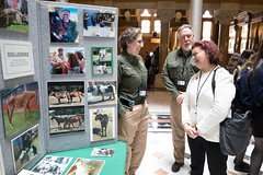 State Reps. Cindy Harrison talks with Sate Animal Control Officer Kelli Baker and Chief State Animal Control Officer Jeremiah Dunn during Agriculture &quot;Ag&quot; Day at the capitol.