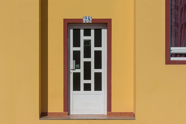 Yellow facade with white door