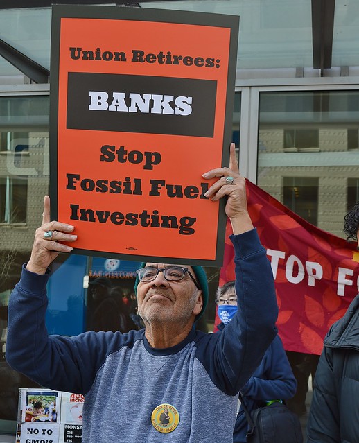 Union retiree at protest outside a branch of Chase Bank.