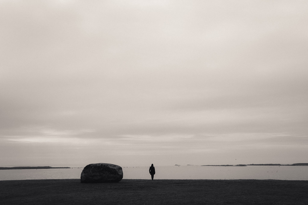 A rock, a man and a sea