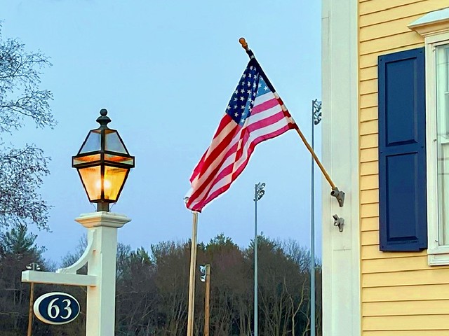 American Flag At L'Hussier Insurance Auto Home With Golden Lantern Lit - Photo Taken On March 21, 2023 And Edited On March 26, 2023 - All Work Done by STEVEN CHATEAUNEUF