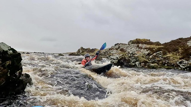 Hannah descending the top rapid  of Dirlot Gorge, Thurso River. Photo by Colin Mathieson.