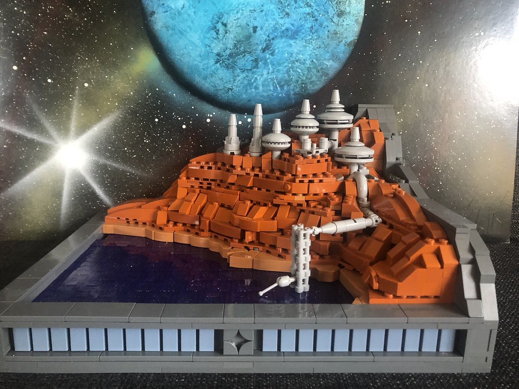 The Purple Waves. A micro scale space mining facility moc I build a month a go. I am really happy with the moc, especially the water. The water is 1x1 bricks in dark purple with glitter on the side.