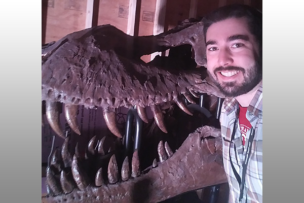 Thomas Cullen with a T. rex skeleton head