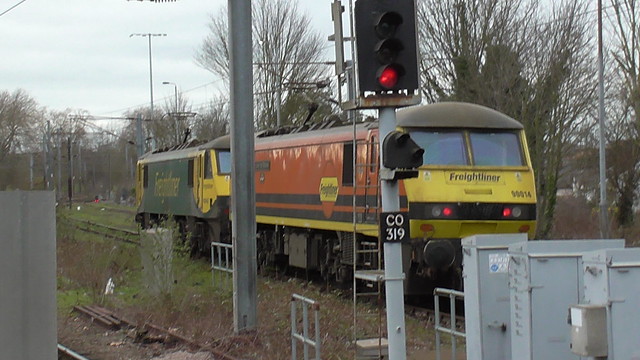 90 014 is stabled with a classmate alongside Ipswich Station.
