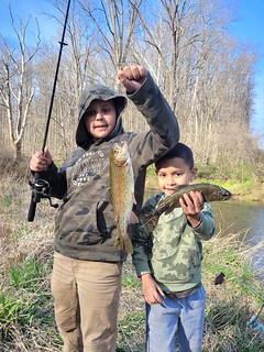 Hunter and Bryson Latchman had a great time fishing for trout and showing off their catch. Photo by Bedesh Latchman