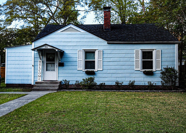 blue modest house / lawn / yard